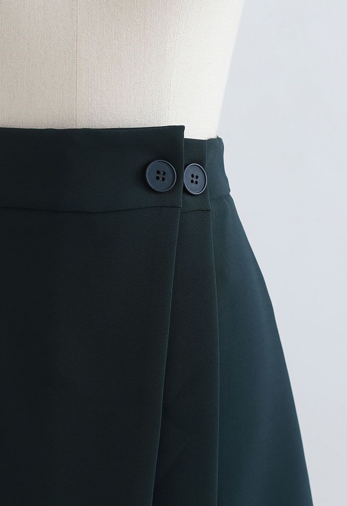 Mini-jupe boutonnée à double rabat en émeraude