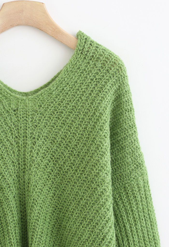 Pull en tricot évidé à col en V en vert
