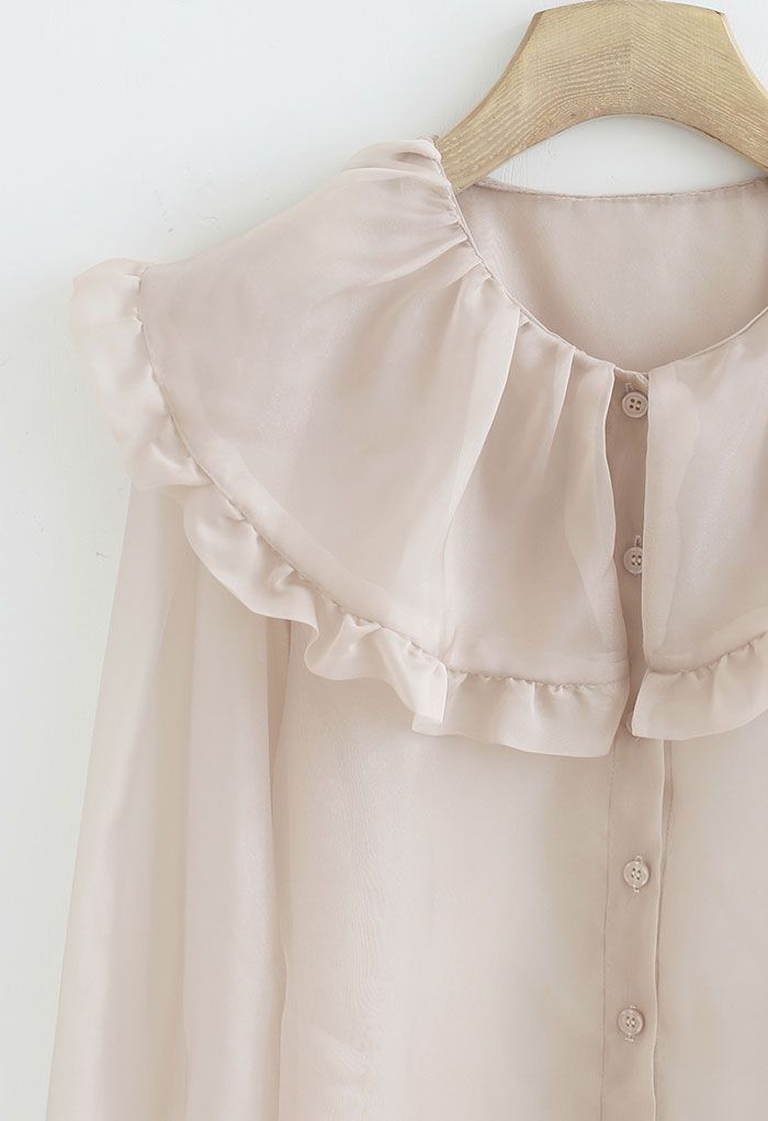 Chemise transparente à col claudine exagéré en rose nude