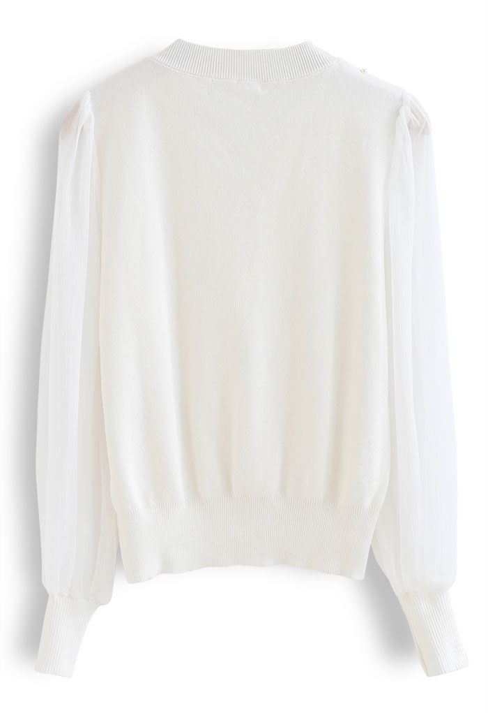 Haut en tricot boutonné nacré à manches transparentes en blanc