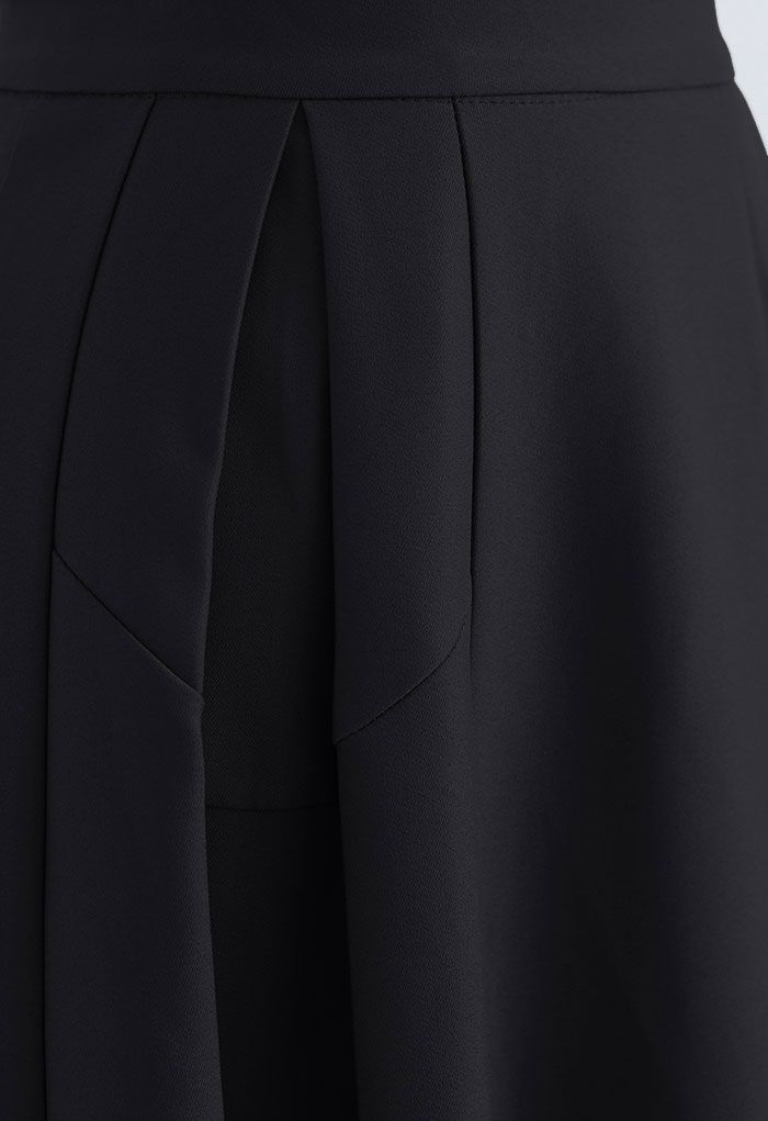 Jupe mi-longue plissée trapèze fonctionnelle en noir