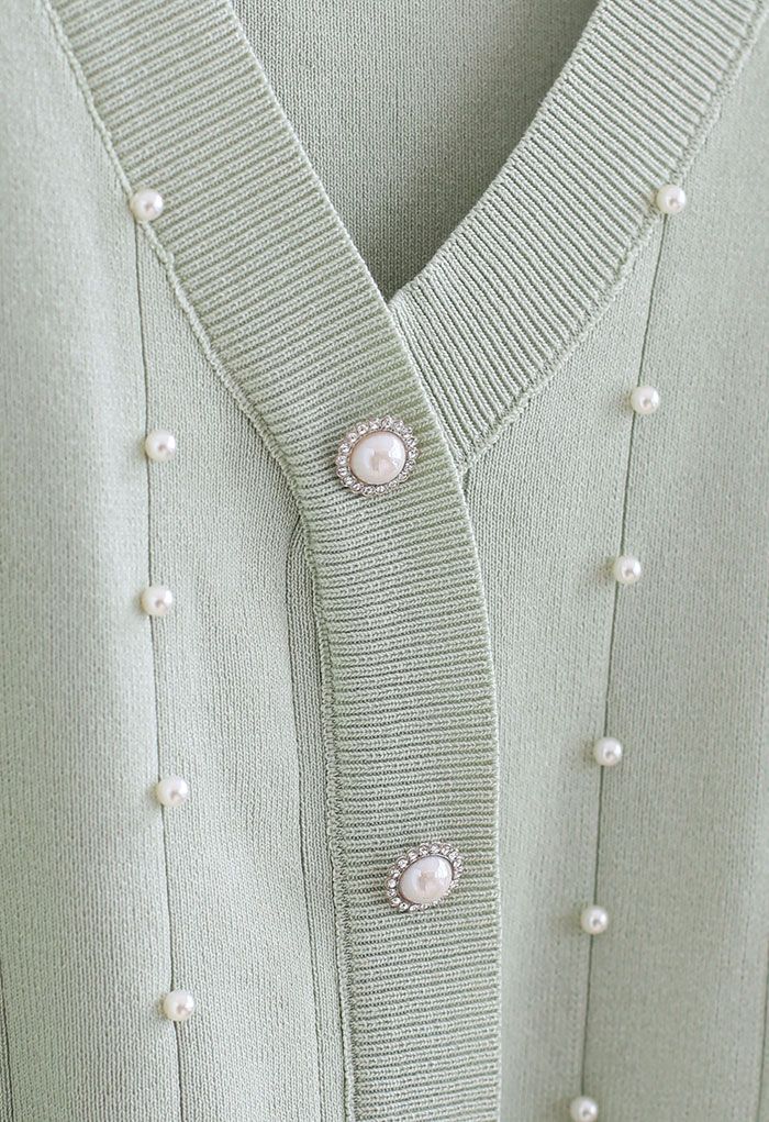 Haut en tricot boutonné nacré à manches transparentes à la menthe