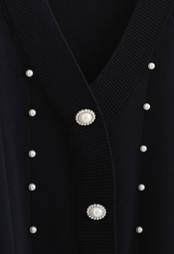 Haut en tricot boutonné nacré à manches transparentes en noir