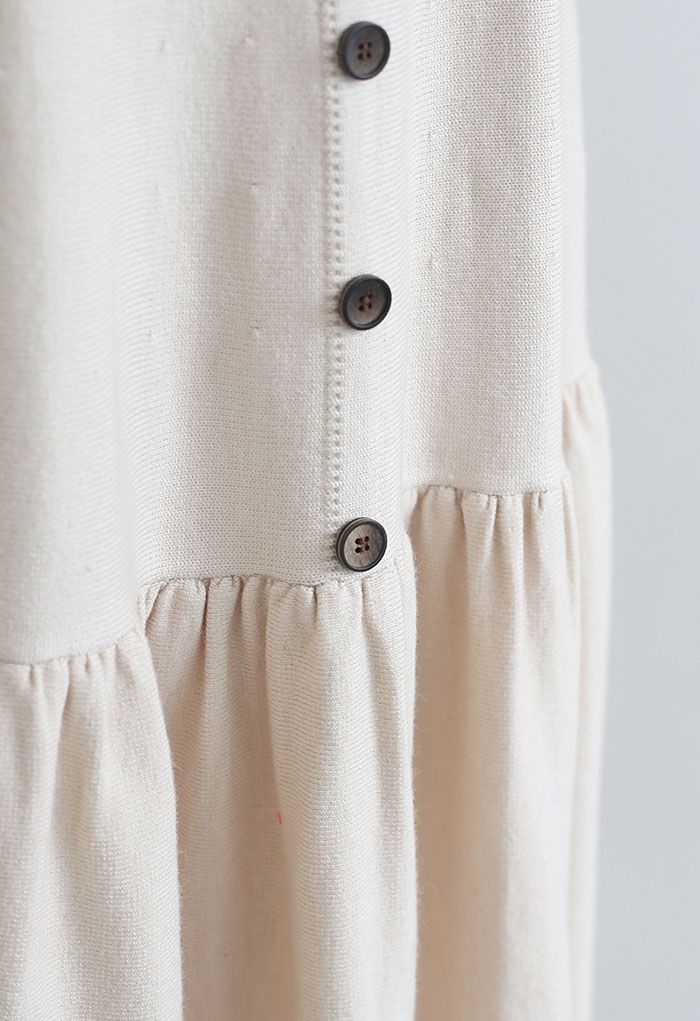 Jupe mi-longue en tricot ornée de boutons à volants en crème