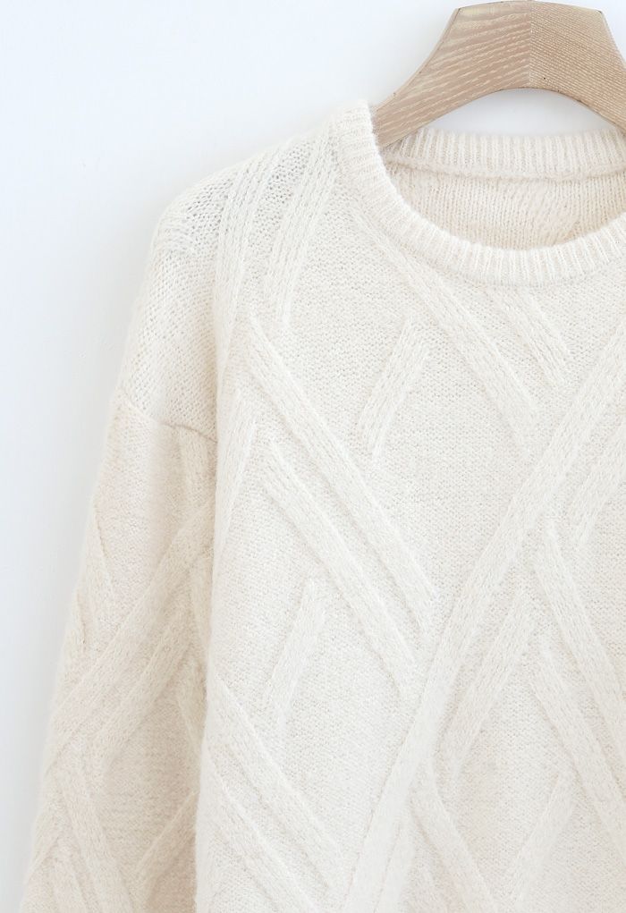 Pull en tricot flou à motif entrecroisé en crème