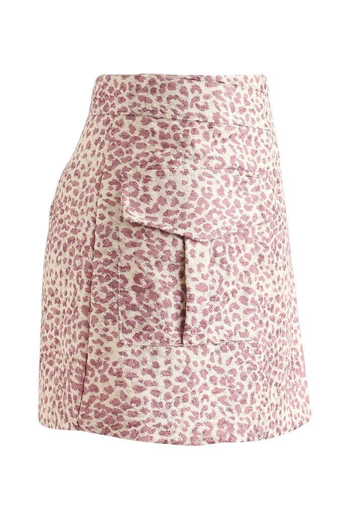 Mini-jupe asymétrique scintillante à motif léopard en rose