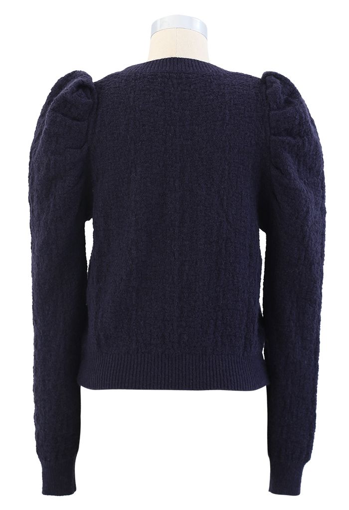 Pull en tricot texturé à épaules bouffantes en bleu marine