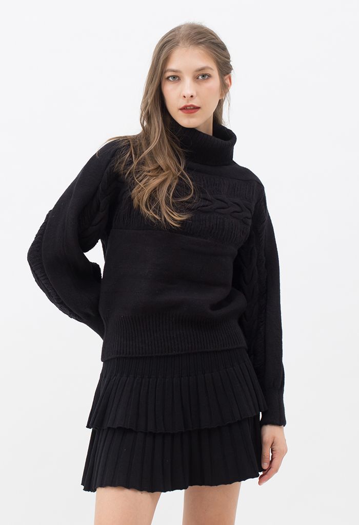 Mini-jupe en tricot plissé à plusieurs niveaux en noir