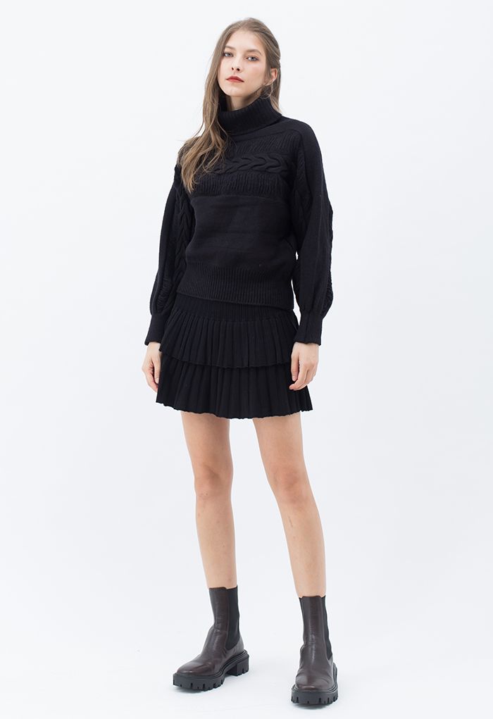 Mini-jupe en tricot plissé à plusieurs niveaux en noir