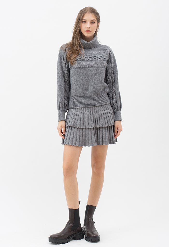Mini-jupe en tricot plissé à plusieurs niveaux en gris