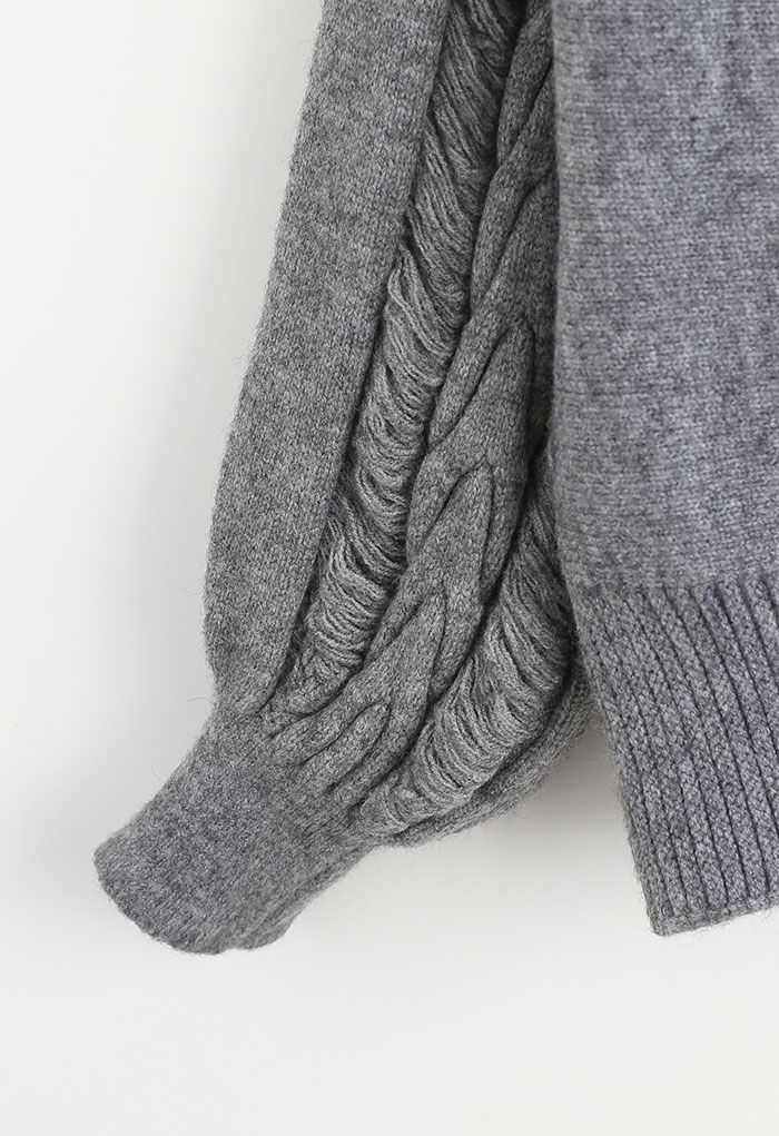 Pull en tricot à col roulé avec détails frangés en gris