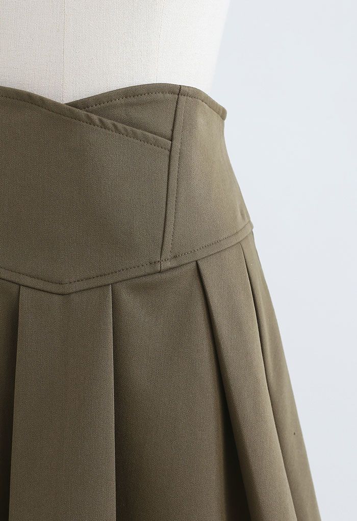 Mini-jupe plissée à taille corset en olive