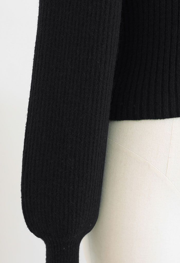 Robe mi-longue en tricot avec ourlet à volants et cordon de serrage en noir