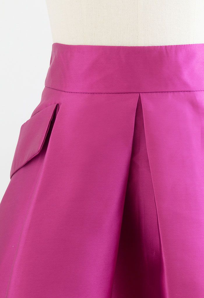 Jupe plissée trapèze avec poches exagérées en magenta