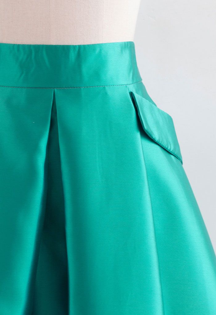 Jupe plissée trapèze avec poches exagérées en turquoise