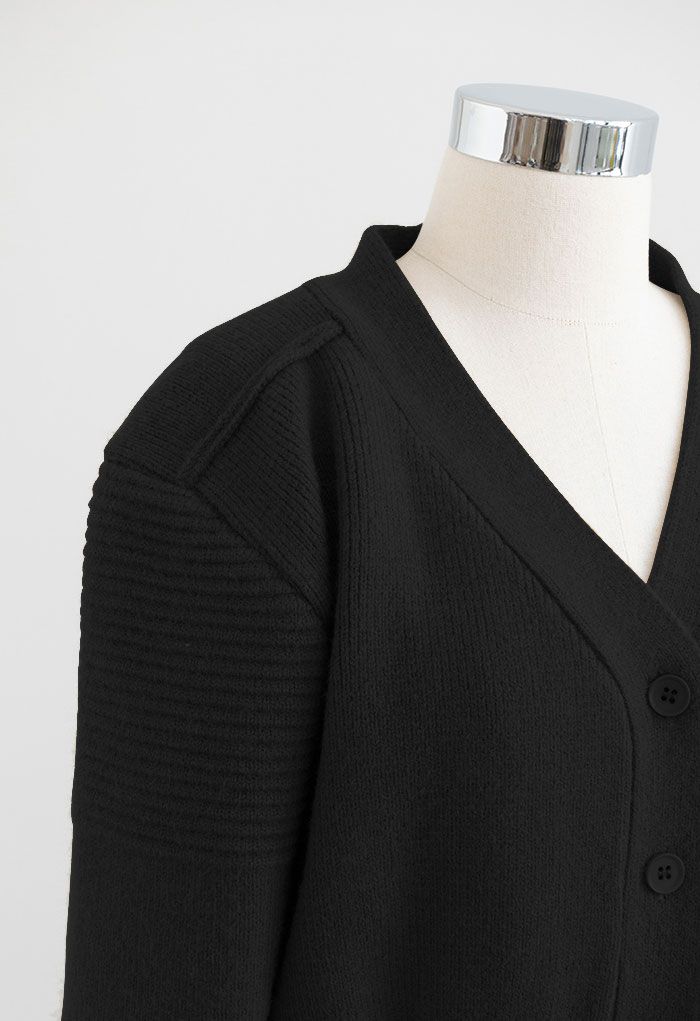 Cardigan en tricot boutonné à manches bouffantes en noir