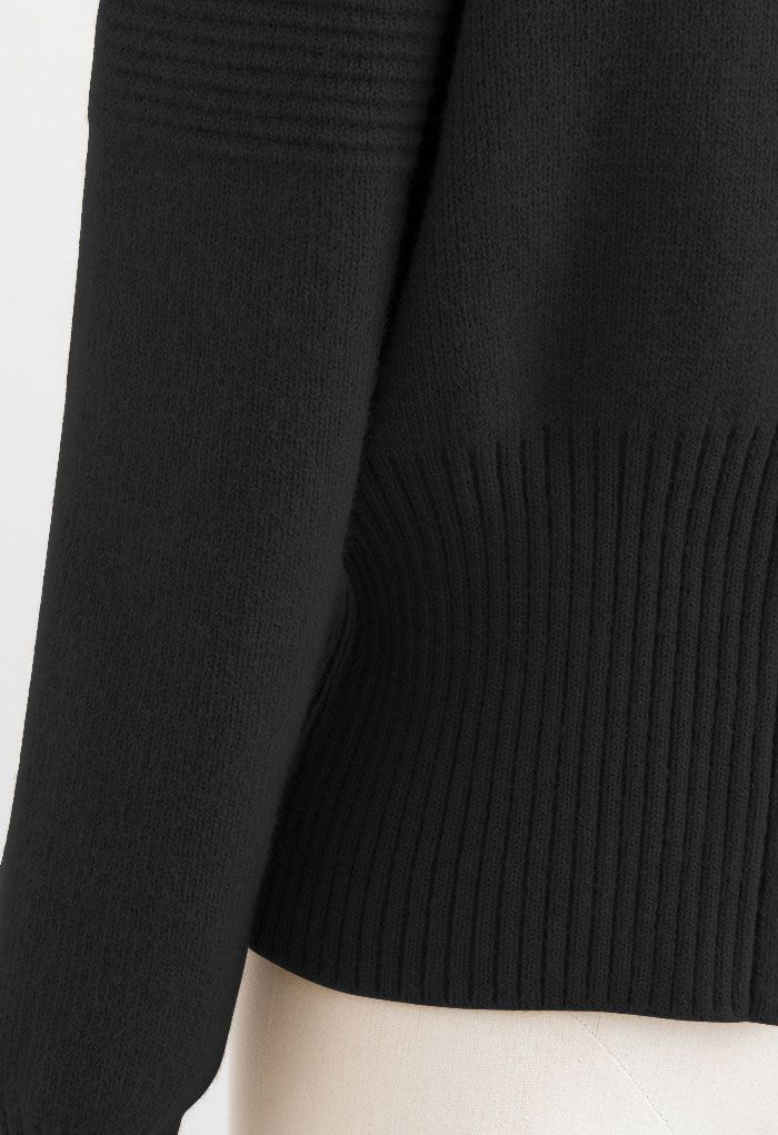 Cardigan en tricot boutonné à manches bouffantes en noir
