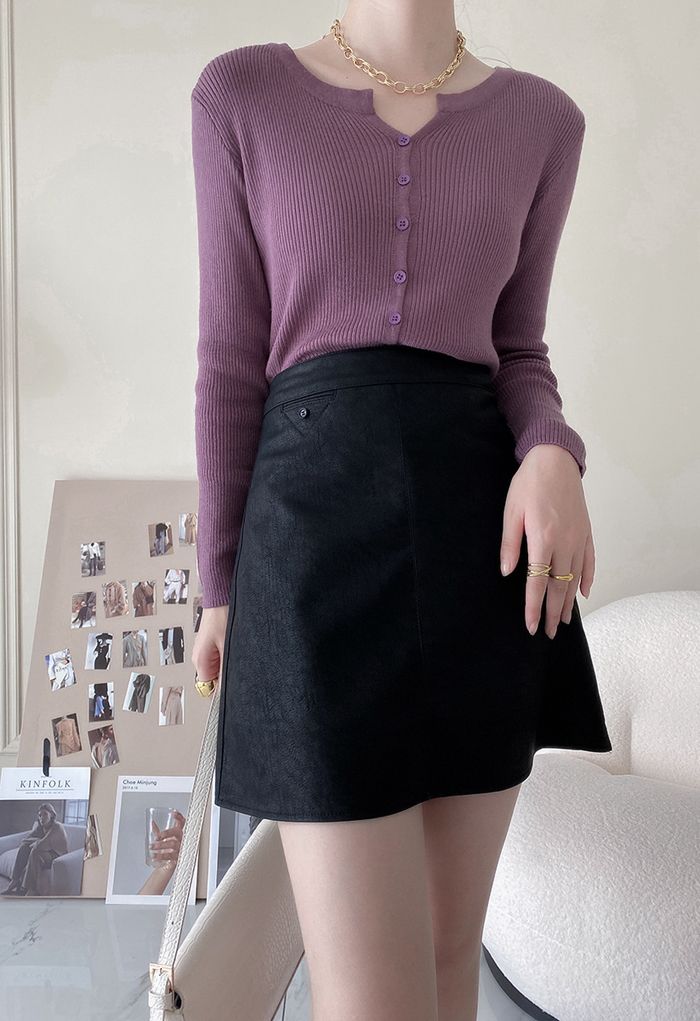 Mini jupe bourgeon en similicuir texturé en noir