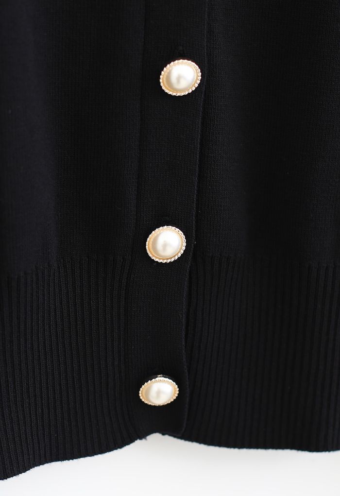 Haut en tricot boutonné à col en V et manches transparentes en noir