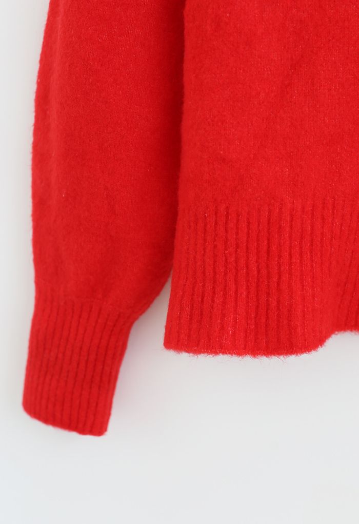 Cardigan en tricot à manches bouffantes avec boutons en forme de cœur en rouge