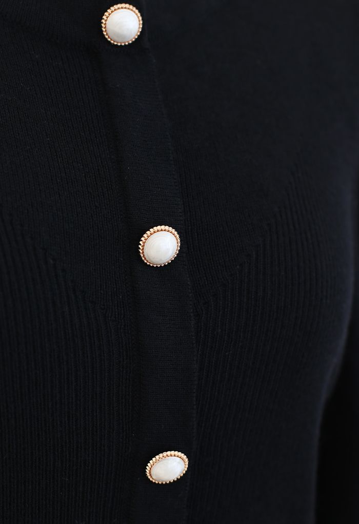 Haut boutonné en tricot côtelé à manches bouffantes en noir