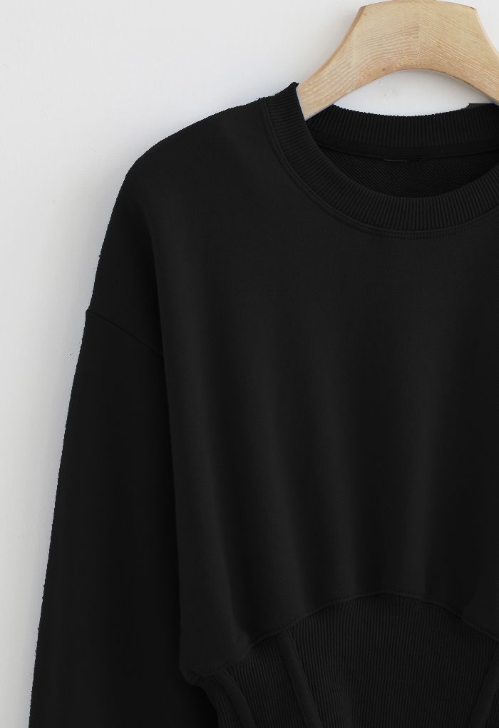 Sweat-shirt court à épaules matelassées en noir