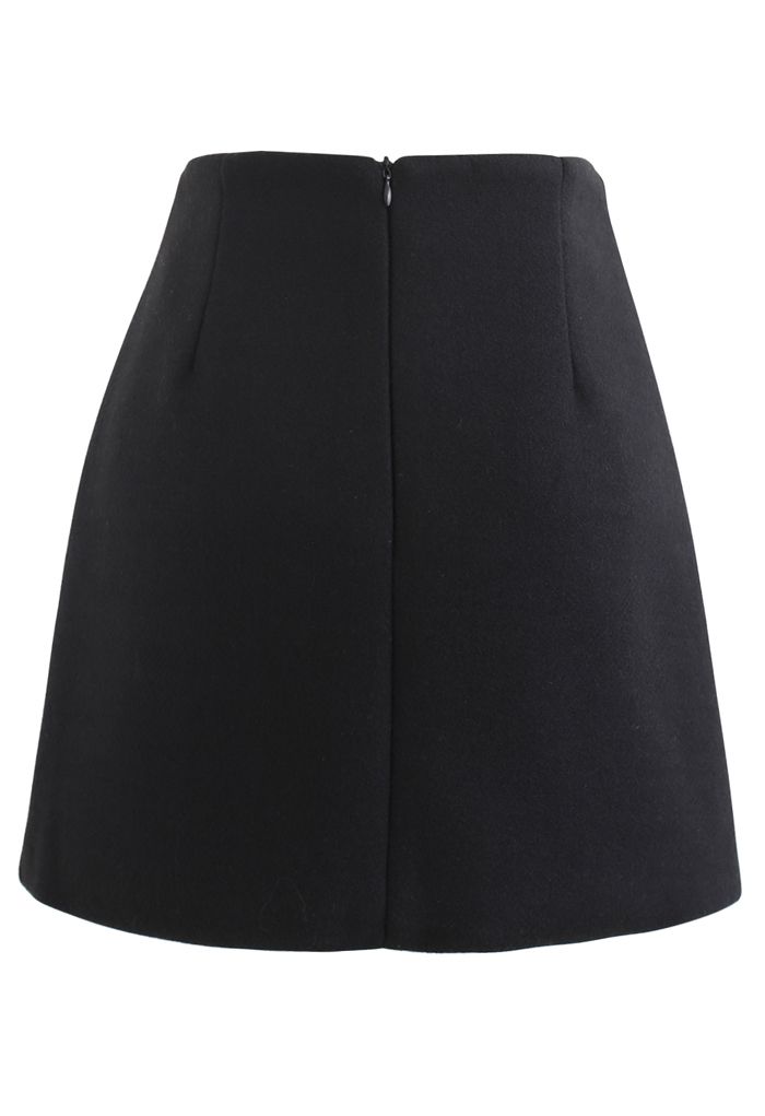 Mini-jupe à rabat boutonné marbré en noir