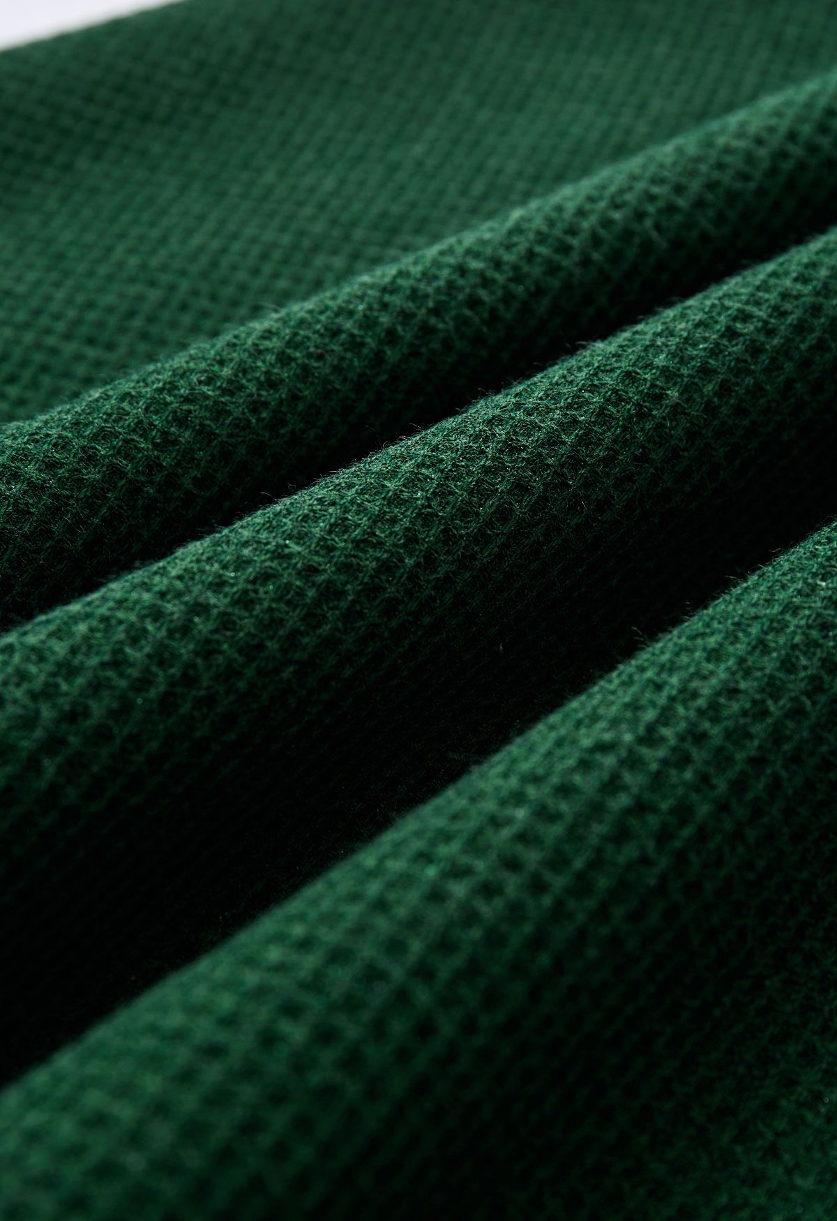 Jupe mi-longue trapèze texturée gaufrée en vert foncé