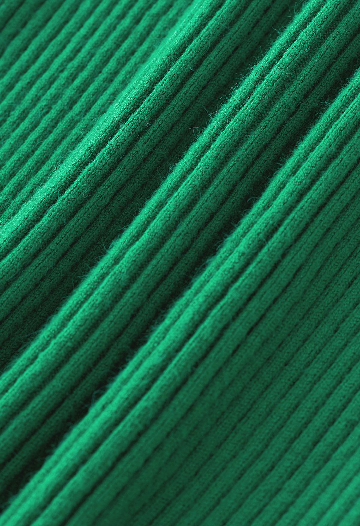 Haut en tricot côtelé à col montant et découpe en vert