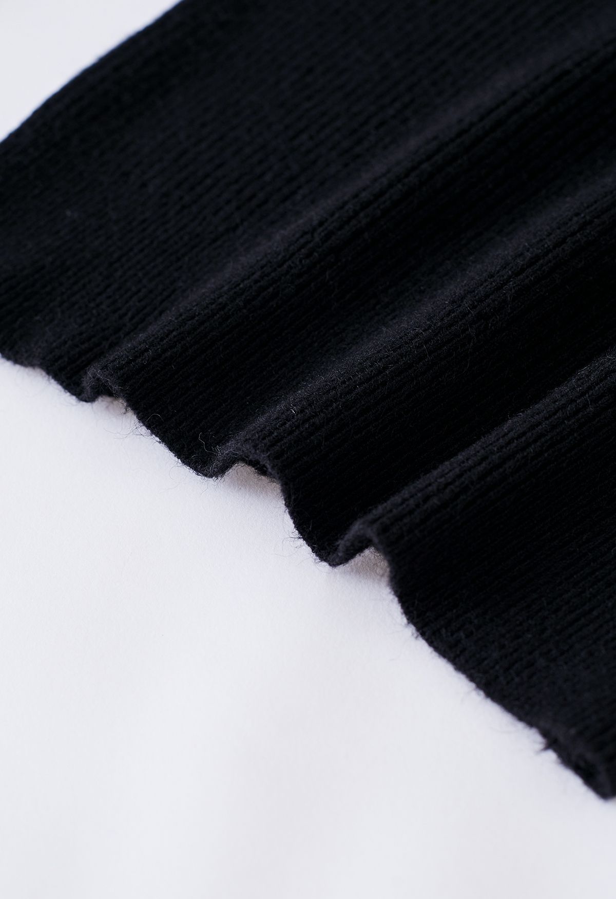 Haut en tricot côtelé torsadé sur le devant en noir