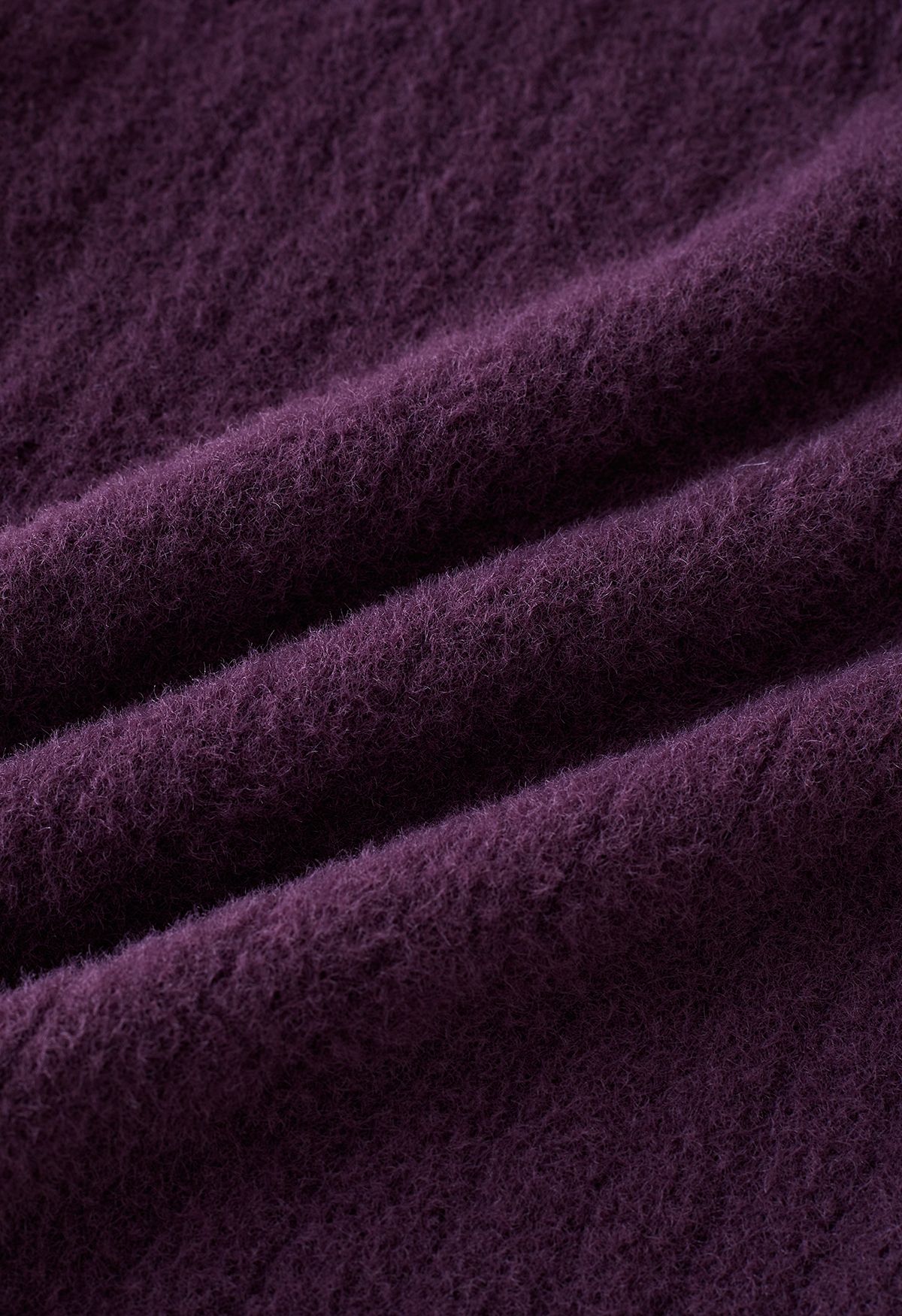 Haut court en tricot à découpes torsadées et épaules dénudées en violet