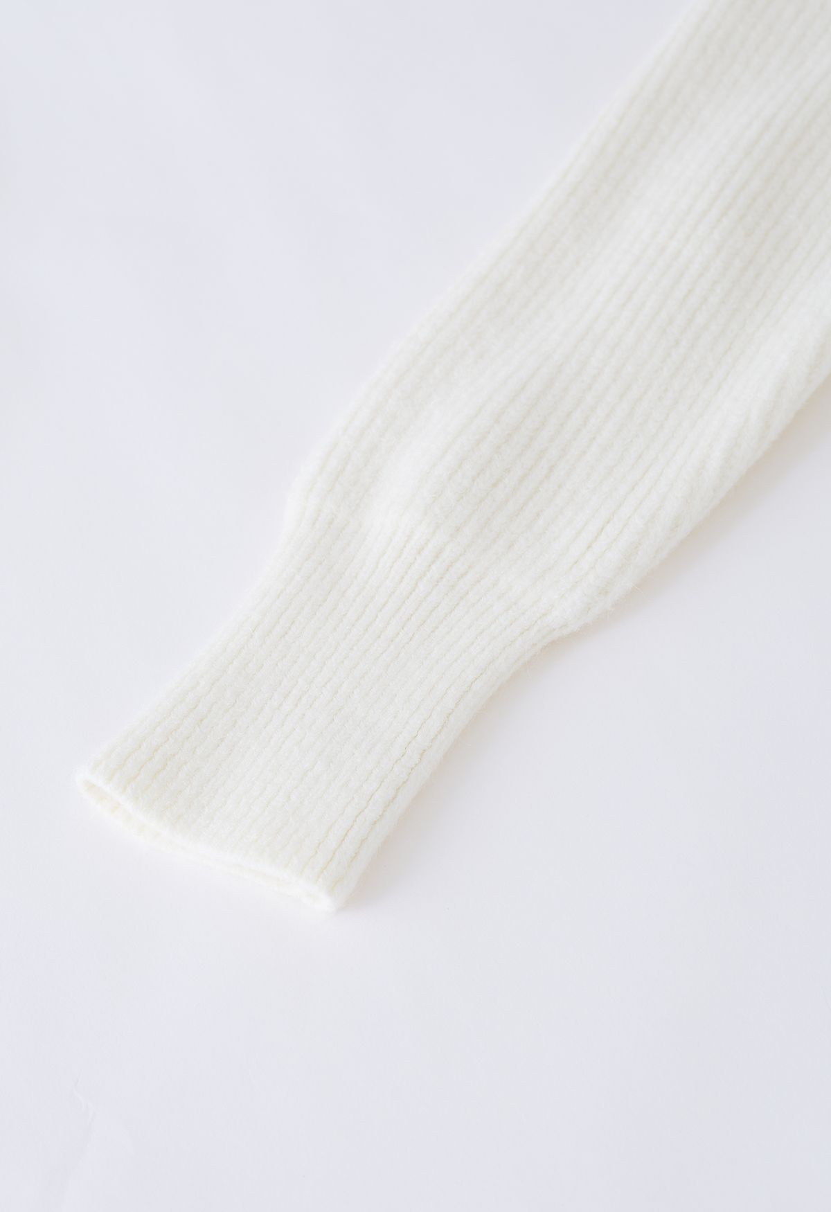 Cardigan en tricot côtelé à fermeture éclair et col à rabat en crème