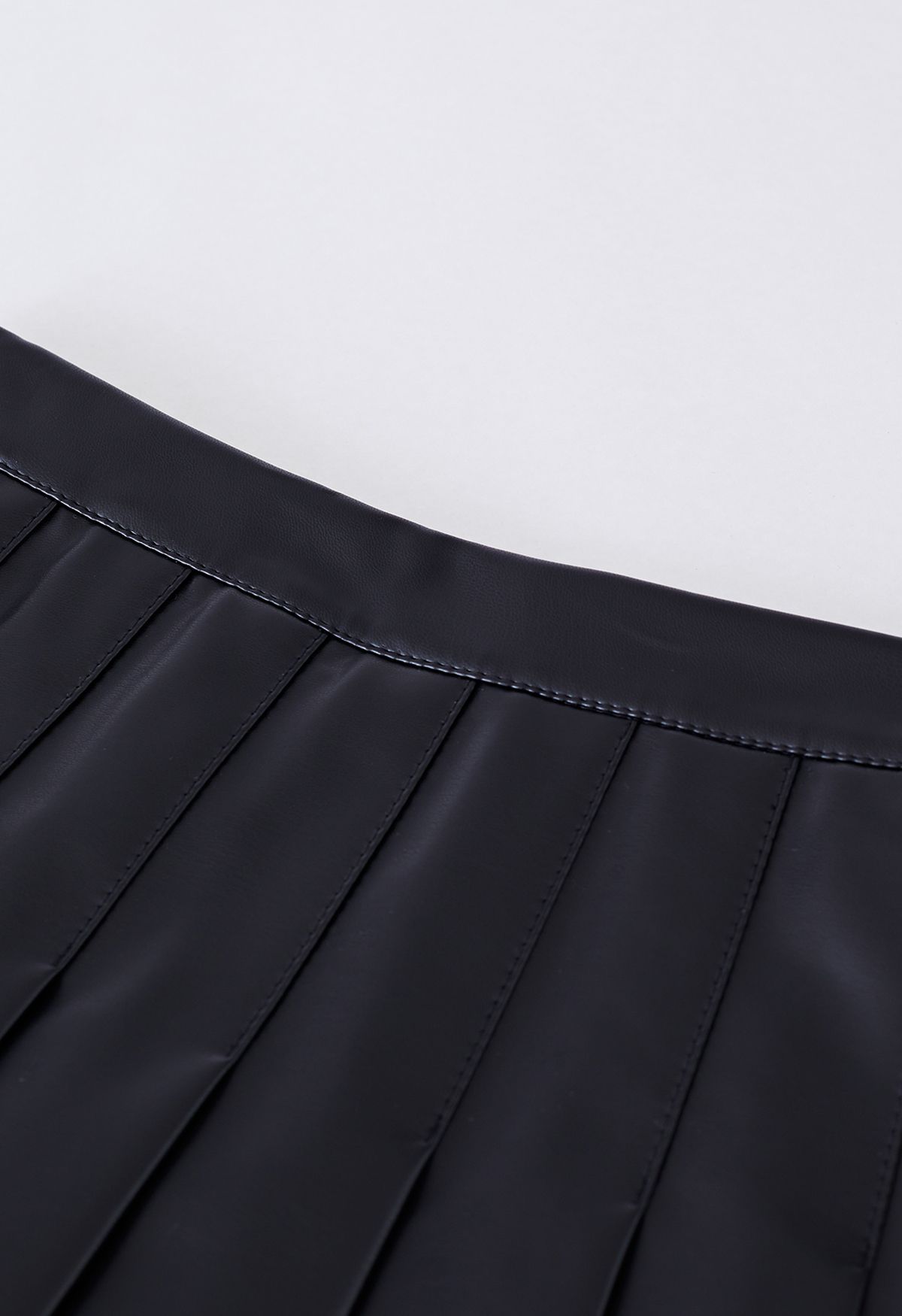 Faux Leather Pleated Flare Mini Skirt in Black