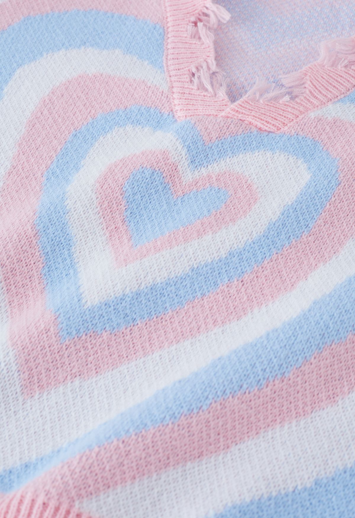 Pull en tricot à bords effilochés cœur multicouche en bleu