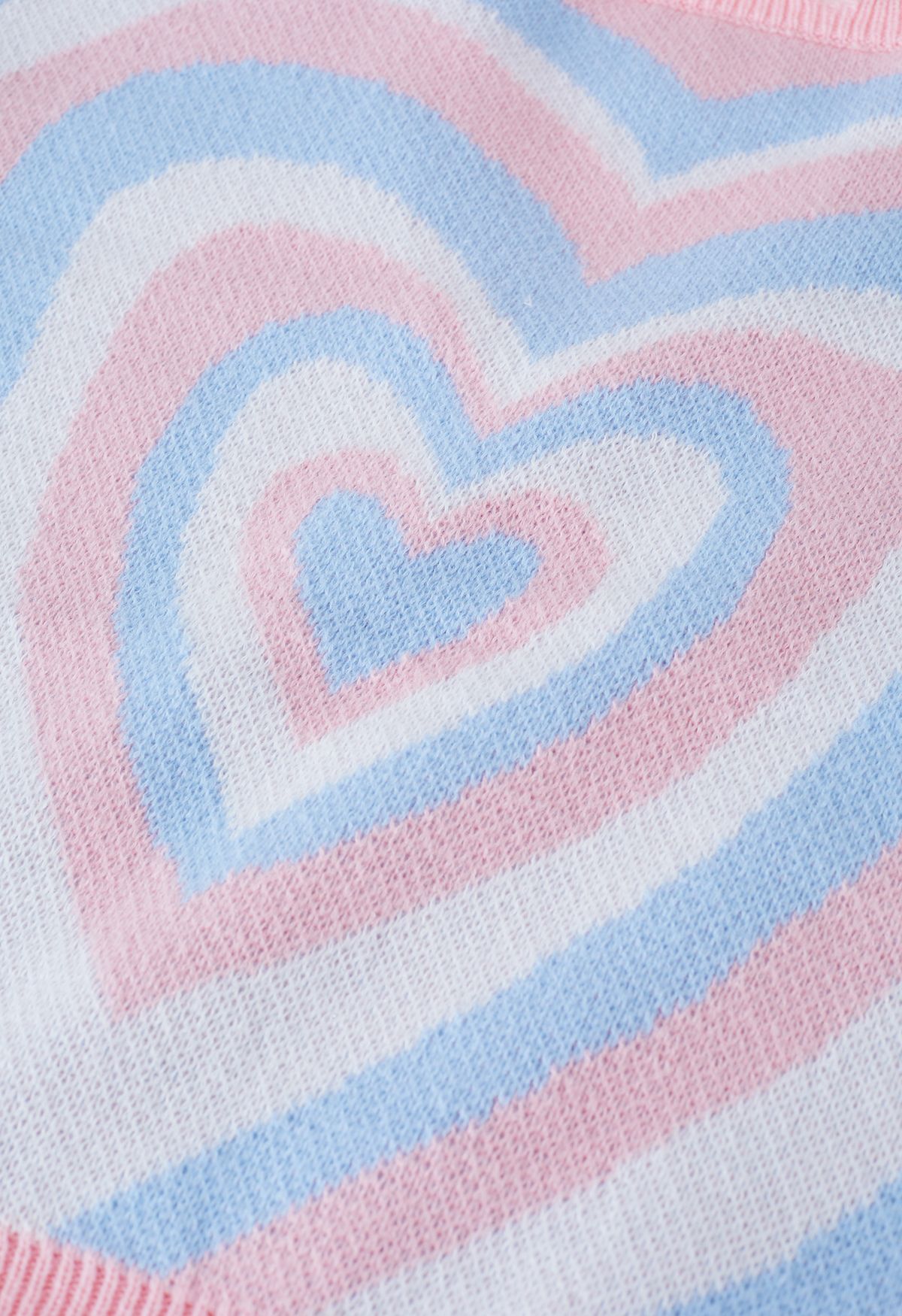 Pull en tricot à bords effilochés cœur multicouche en bleu