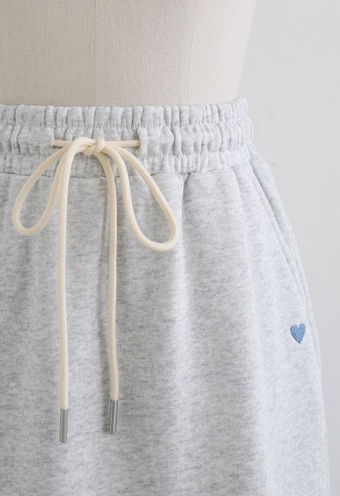 Mini jupe à cordon de serrage en forme de cœur en gris