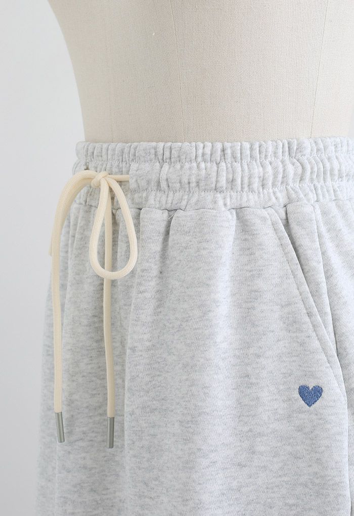 Mini jupe à cordon de serrage en forme de cœur en gris