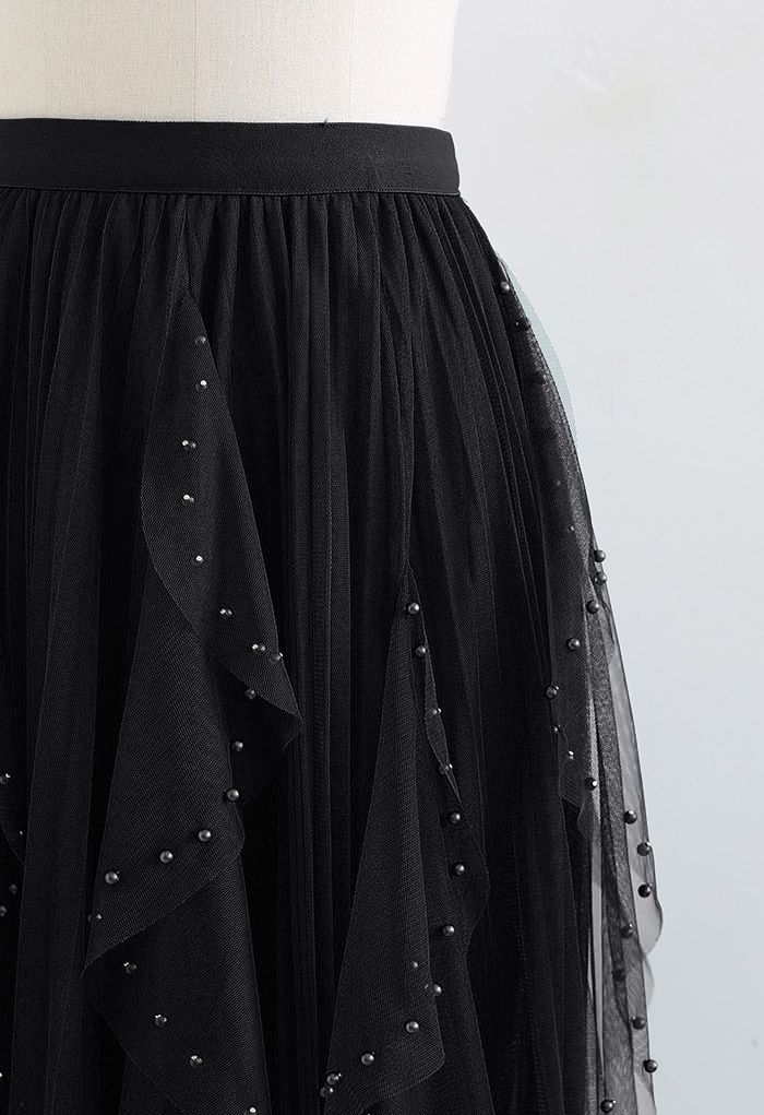 Jupe plissée en tulle à décor de perles dispersées en noir