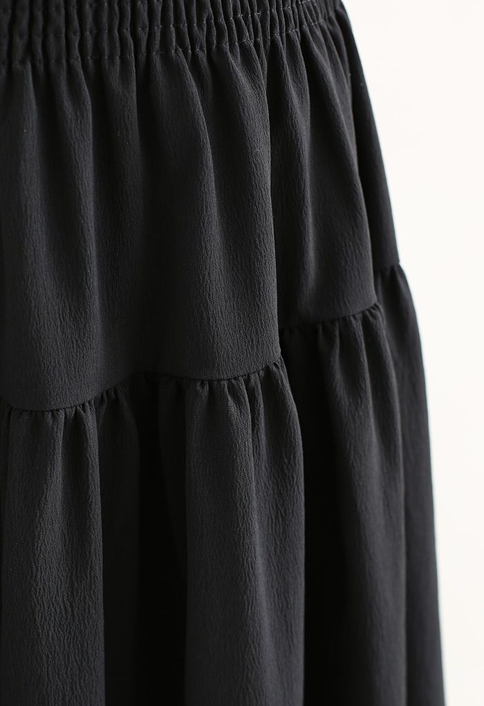 Jupe longue noire texturée à taille froncée