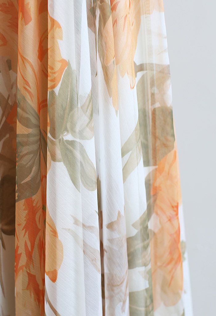Jupe longue en mousseline de soie à imprimé de fleurs vibrantes en orange
