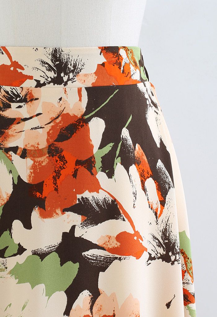 Jupe mi-longue à imprimé floral abstrait en orange
