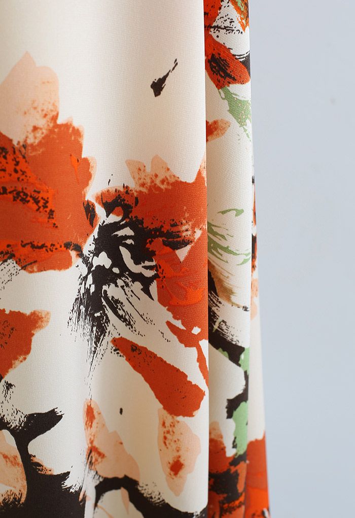 Jupe mi-longue à imprimé floral abstrait en orange