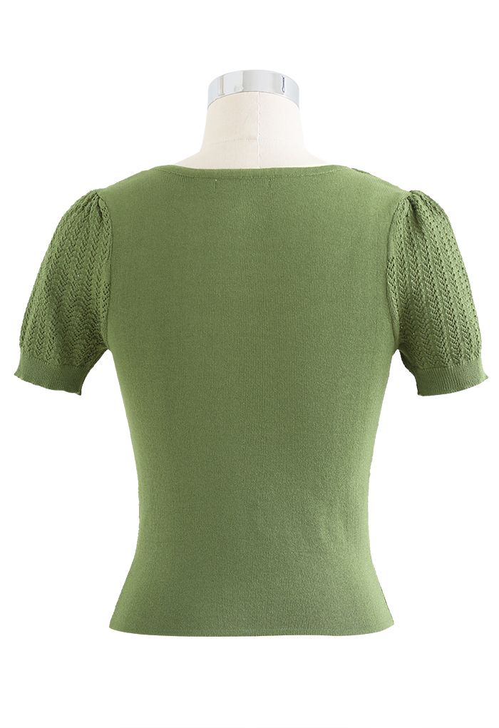 Haut épissé en tricot évidé à col torsadé en vert