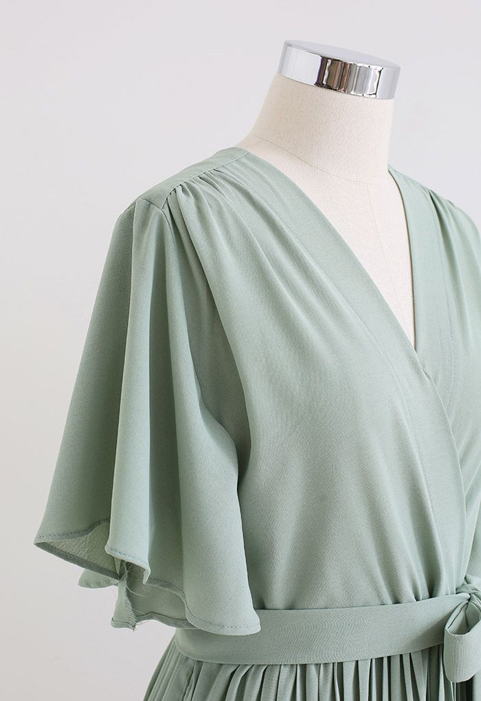 Robe mi-longue plissée à taille nouée effet portefeuille en vert pois