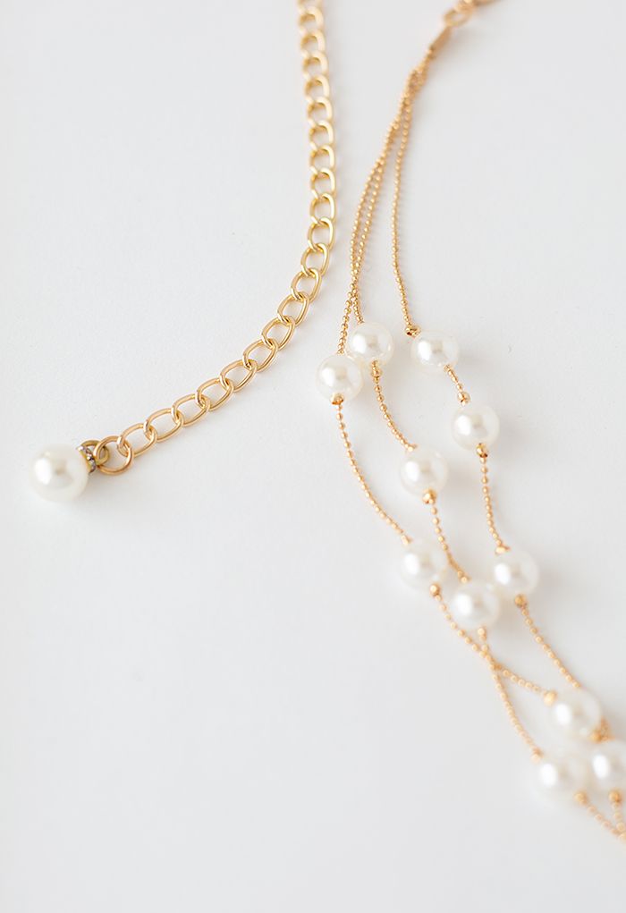 Ceinture en chaîne dorée superposée de perles