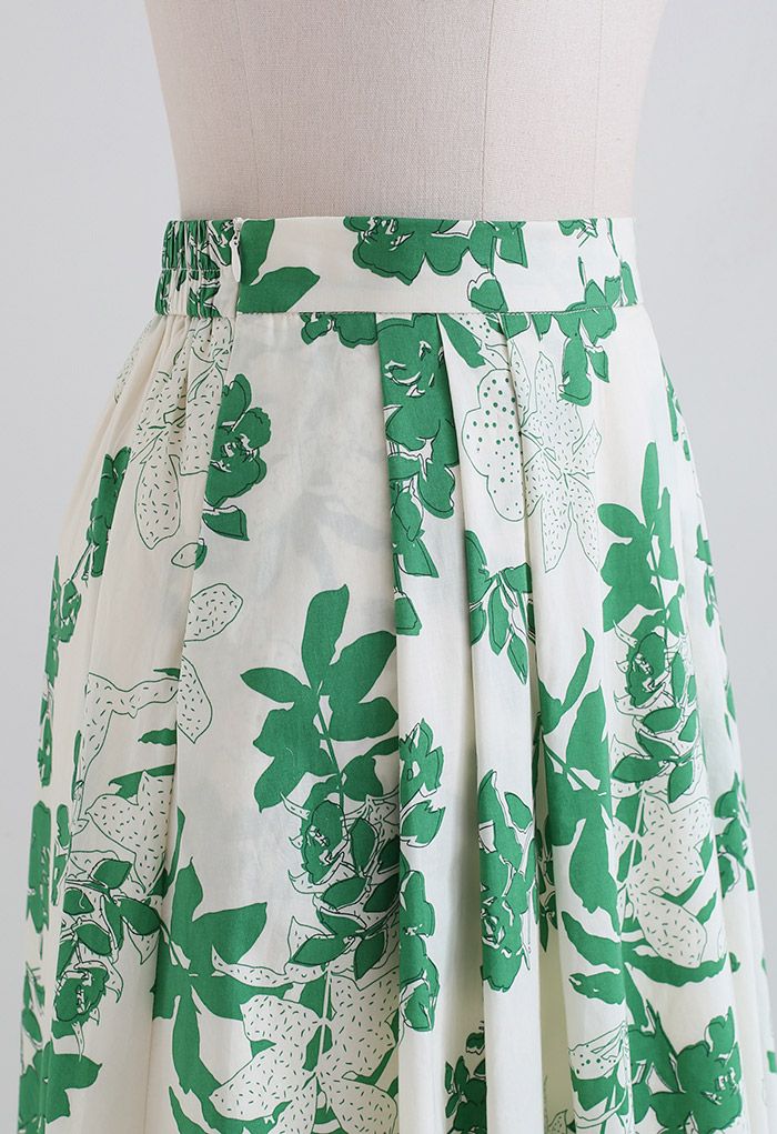 Jupe mi-longue verte en coton à fleurs et poche latérale