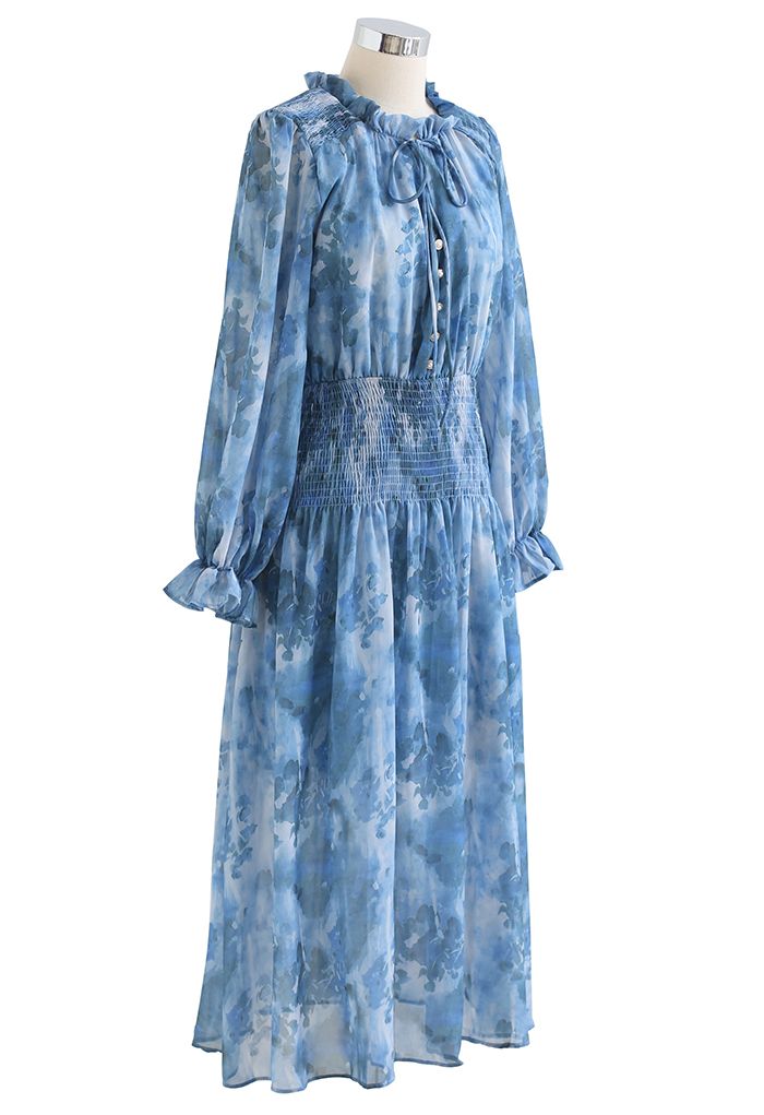 Robe mi-longue bleue à col en V et imprimé aquarelle