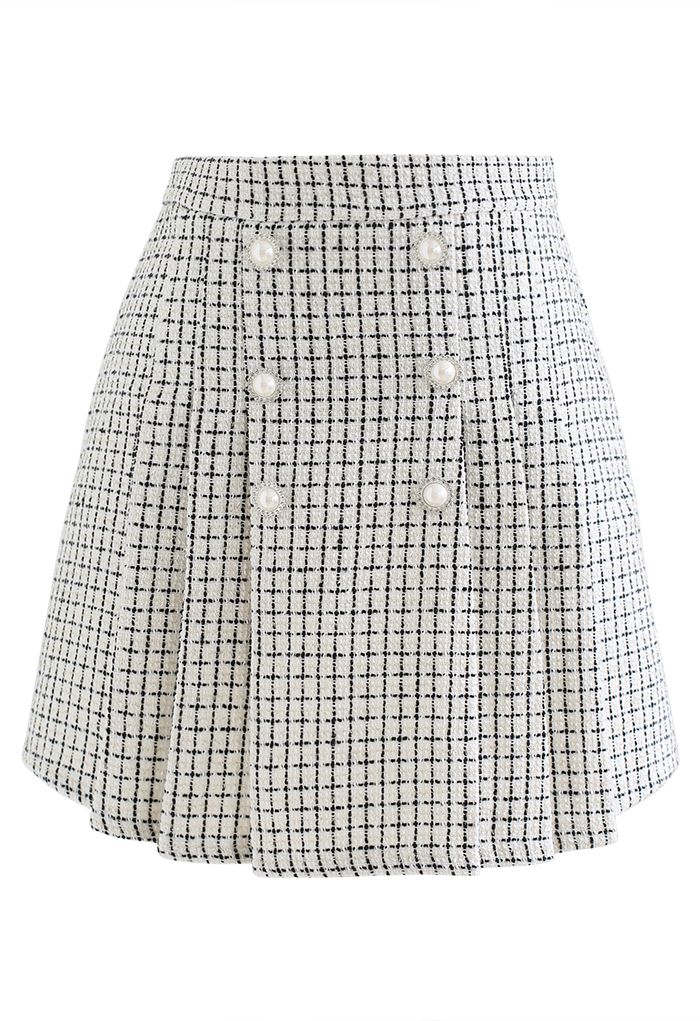 Mini-jupe en tweed à carreaux et boutons nacrés en blanc