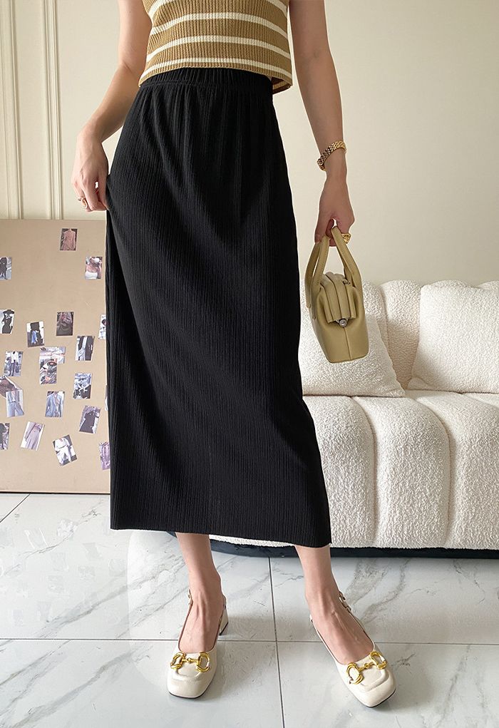 Jupe mi-longue plissée noire texturée