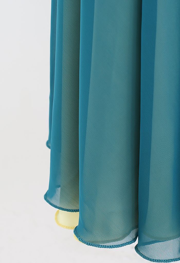 Jupe longue portefeuille épissée à taille nouée en bleu sarcelle